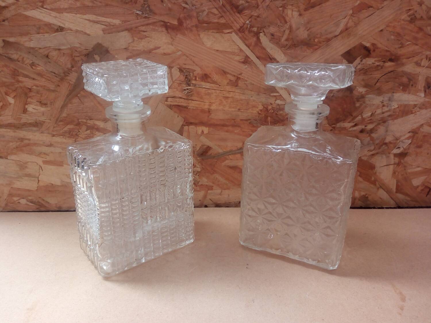 Pair of molded glass whiskey liqueur carafes + vintage stoppers