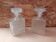 Pair of molded glass whiskey liqueur carafes + vintage stoppers