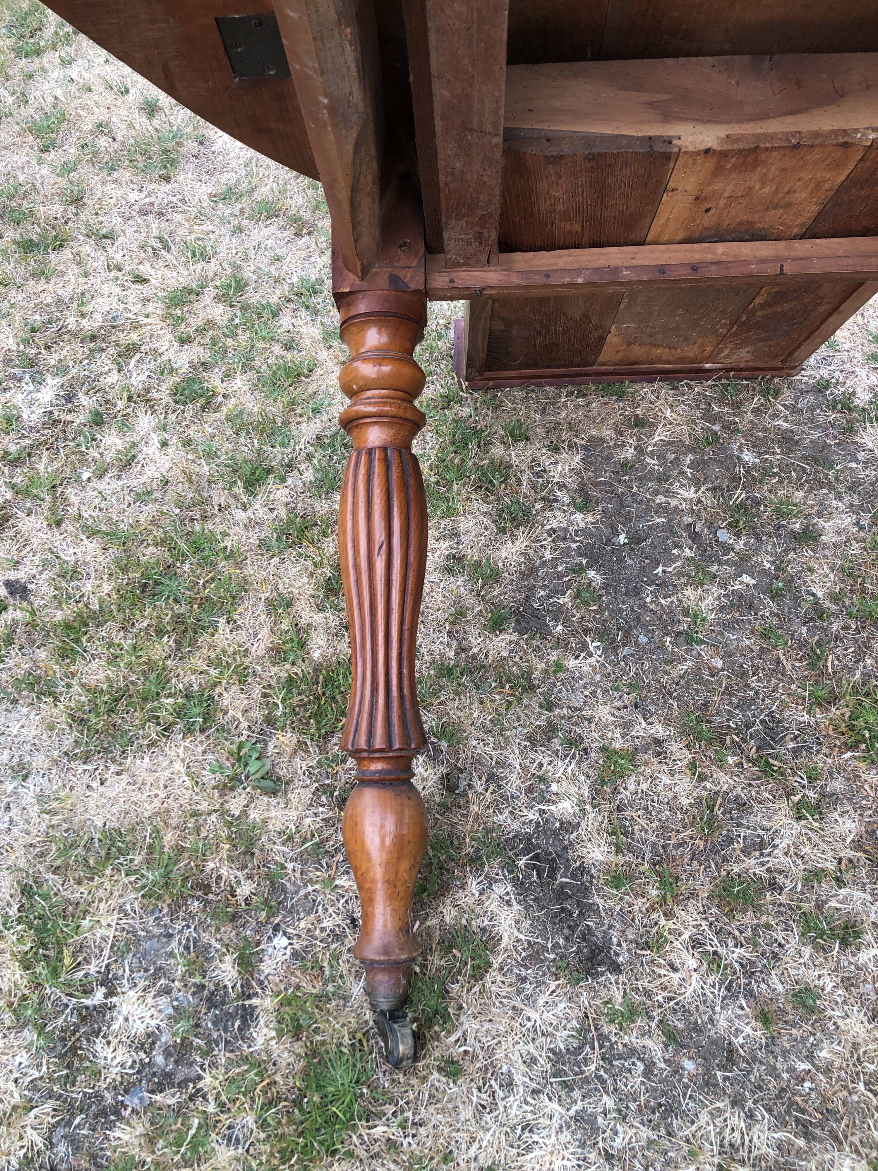 Louis Philippe oval drop-leaf table in solid cherry wood with 2 drawers.