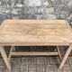 Art Deco farmhouse table made of raw wood.