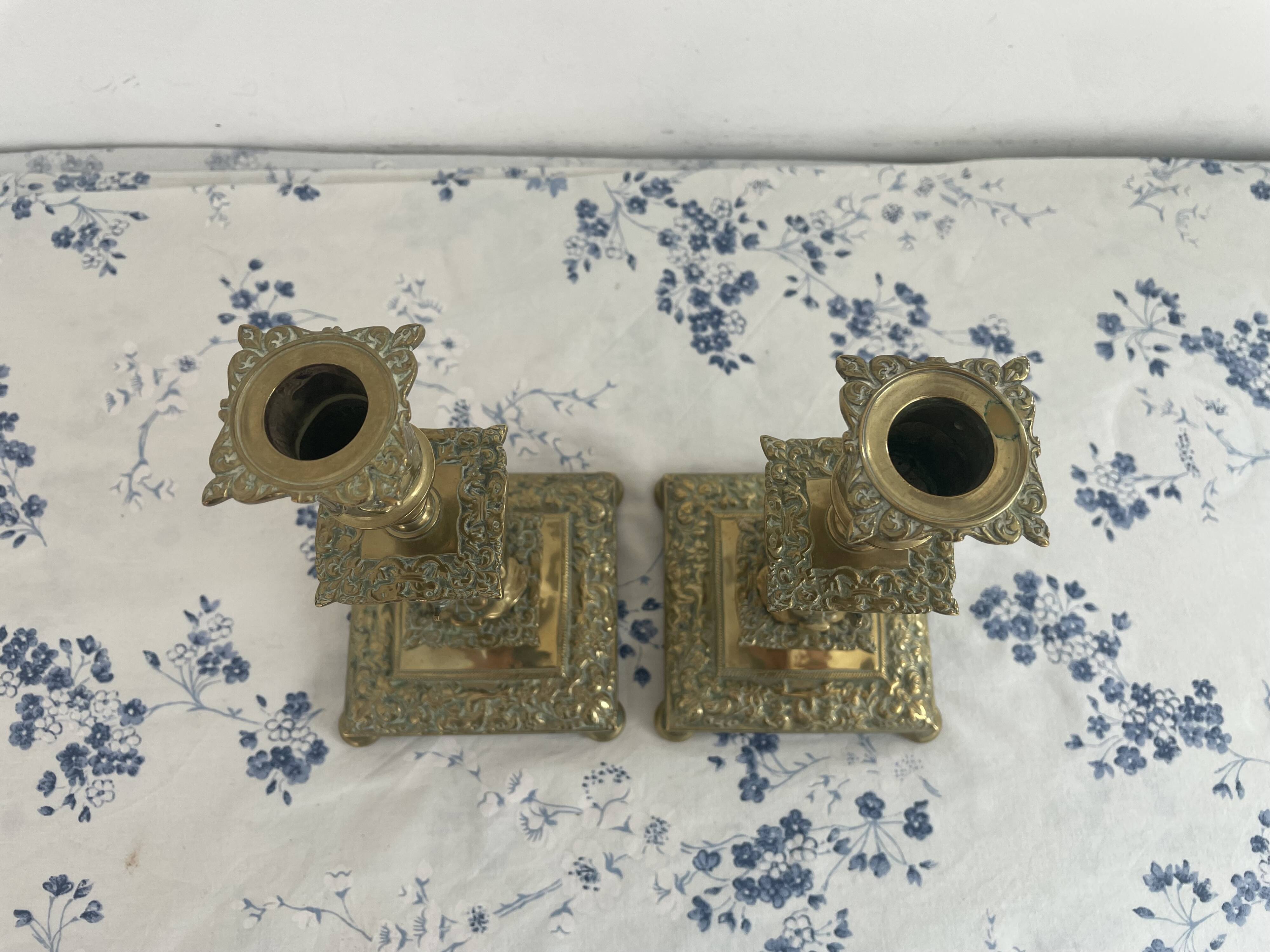 Pair of brass dolphin candlesticks, late 19th century, Napoleonic period