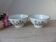 Two speckled beige ceramic bowls for breakfast with a pink flower design.