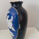 Cobalt blue porcelain vase from Limoges, France with floral pattern.