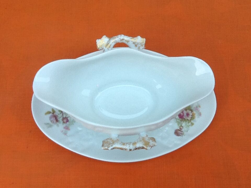 Sauce boat on dormant white porcelain, floral decoration