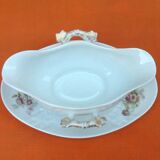 Sauce boat on dormant white porcelain, floral decoration