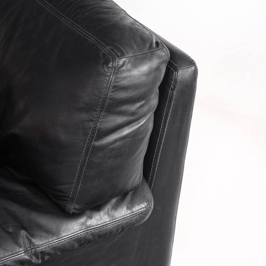 Black leather two-seater sofa. Roche Bobois edition. France, 1980s.