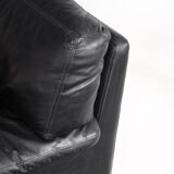 Black leather two-seater sofa. Roche Bobois edition. France, 1980s.