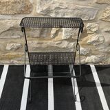 Black perforated metal magazine rack