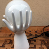 Hand-shaped lamp and opaline globe