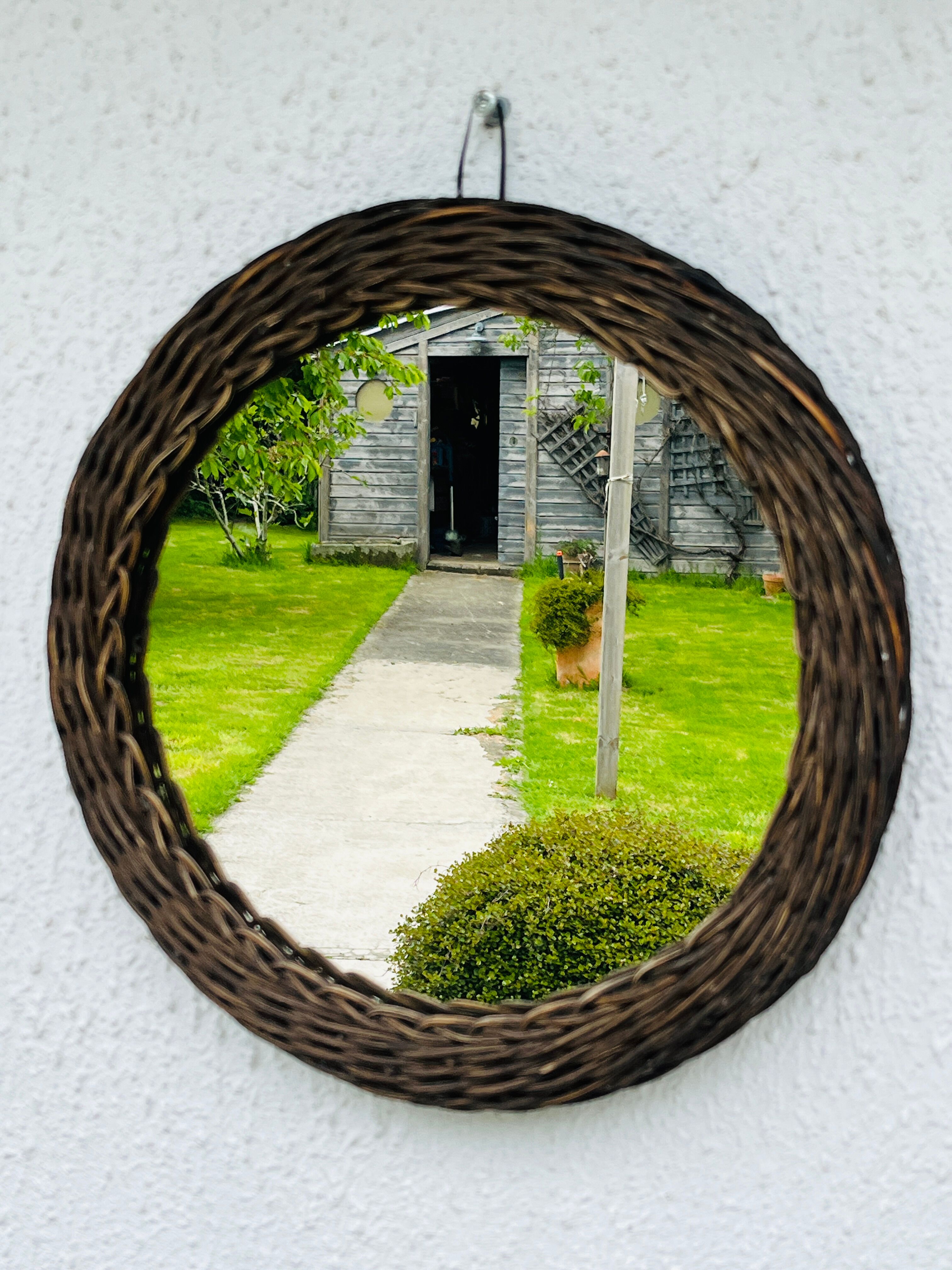 Vintage sun mirror in woven wicker