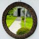 Vintage sun mirror in woven wicker