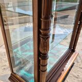 Showcase bookcase in molded and carved walnut