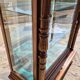 Showcase bookcase in molded and carved walnut