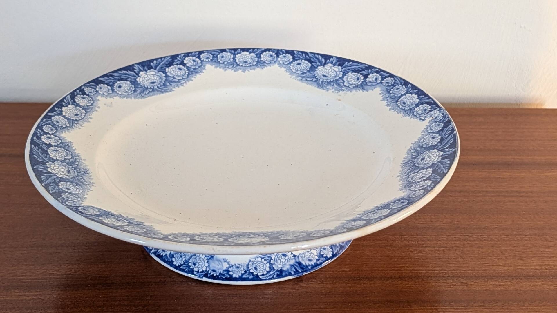 Antique compote dish with blue floral decoration.