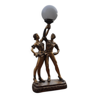 Art Deco desk lamp in gilded bronze with a white glass globe, featuring dancer figurines.