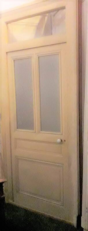 Large glazed door and its old glazed transom.