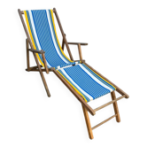 Vintage deck chair with blue and yellow striped fabric, original patina.