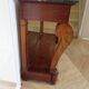 Empire/Restoration style console table with scrolled ends, mirrored back, and claw feet.