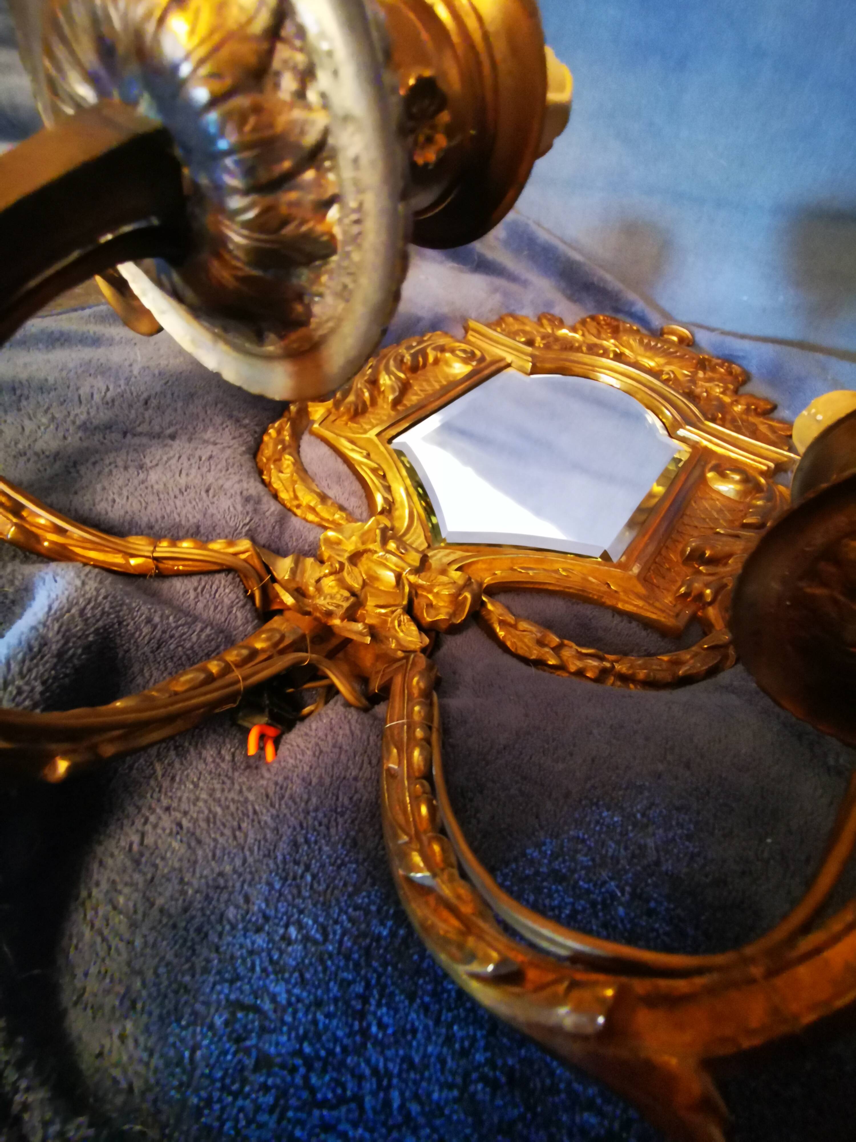 Pair of chissed and gilded bronze mirrors forming appliques