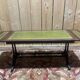 English Regency coffee table, mahogany & green stamped leather with gold.