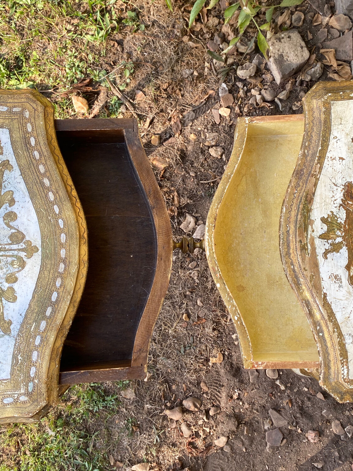 Pairs of Florentine bedside tables in gilded wood.