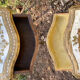 Pairs of Florentine bedside tables in gilded wood.