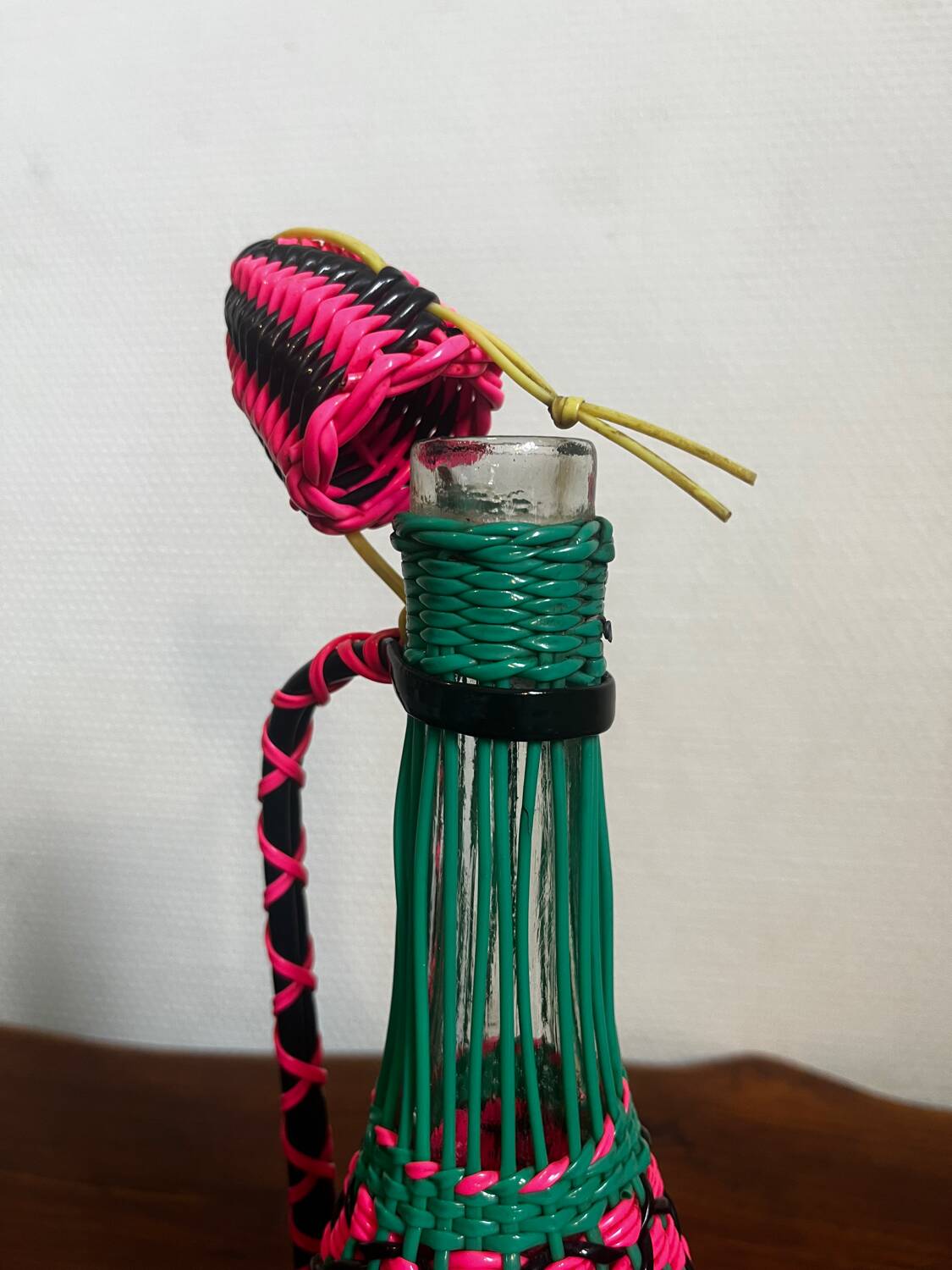 Old glass bottle and scoubidou