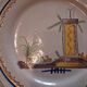 Plate dish with scalloped edges in Nevers earthenware in good condition from the 18th century.