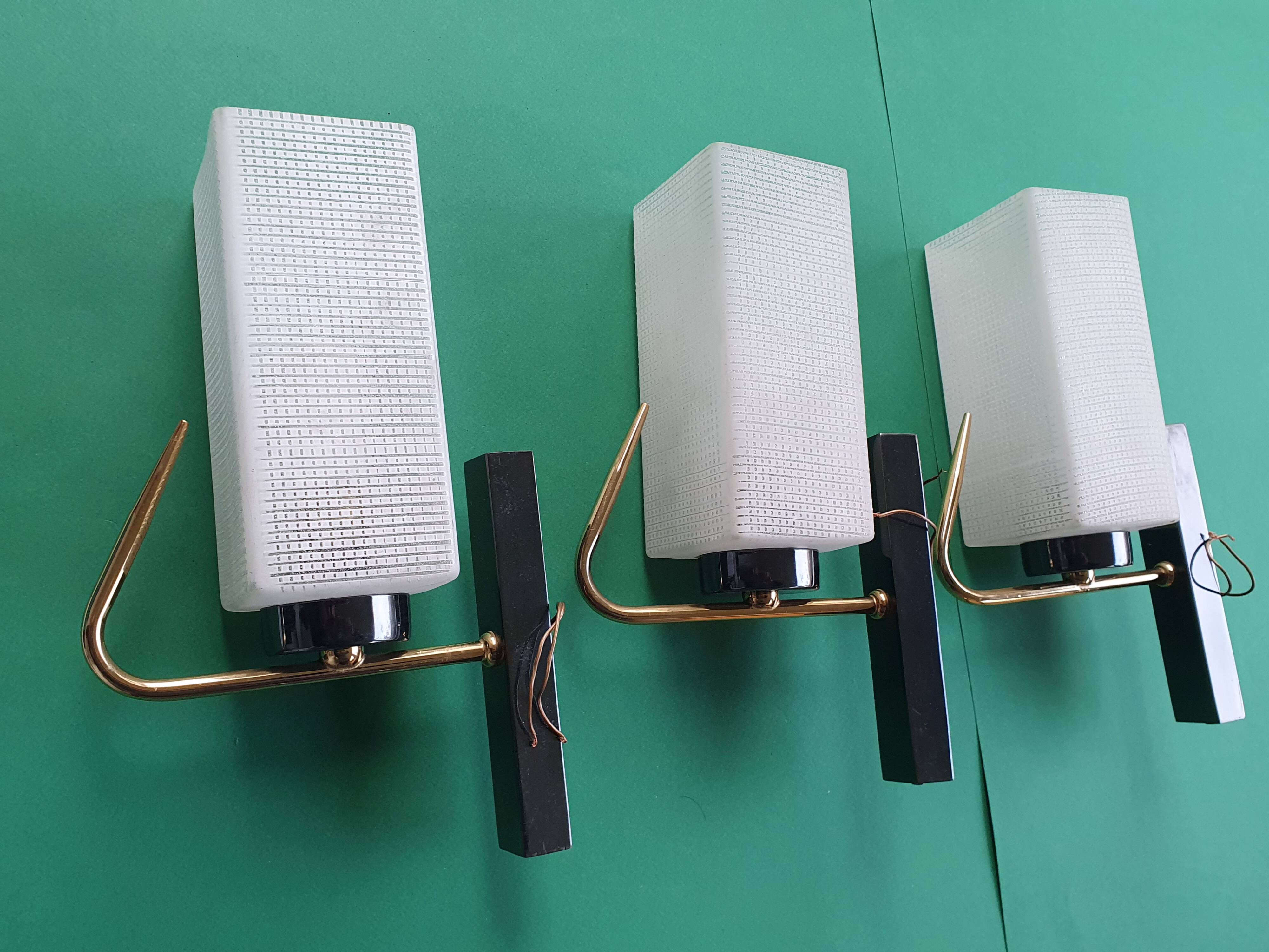 Three antique gold Arlus wall lights from the 50s