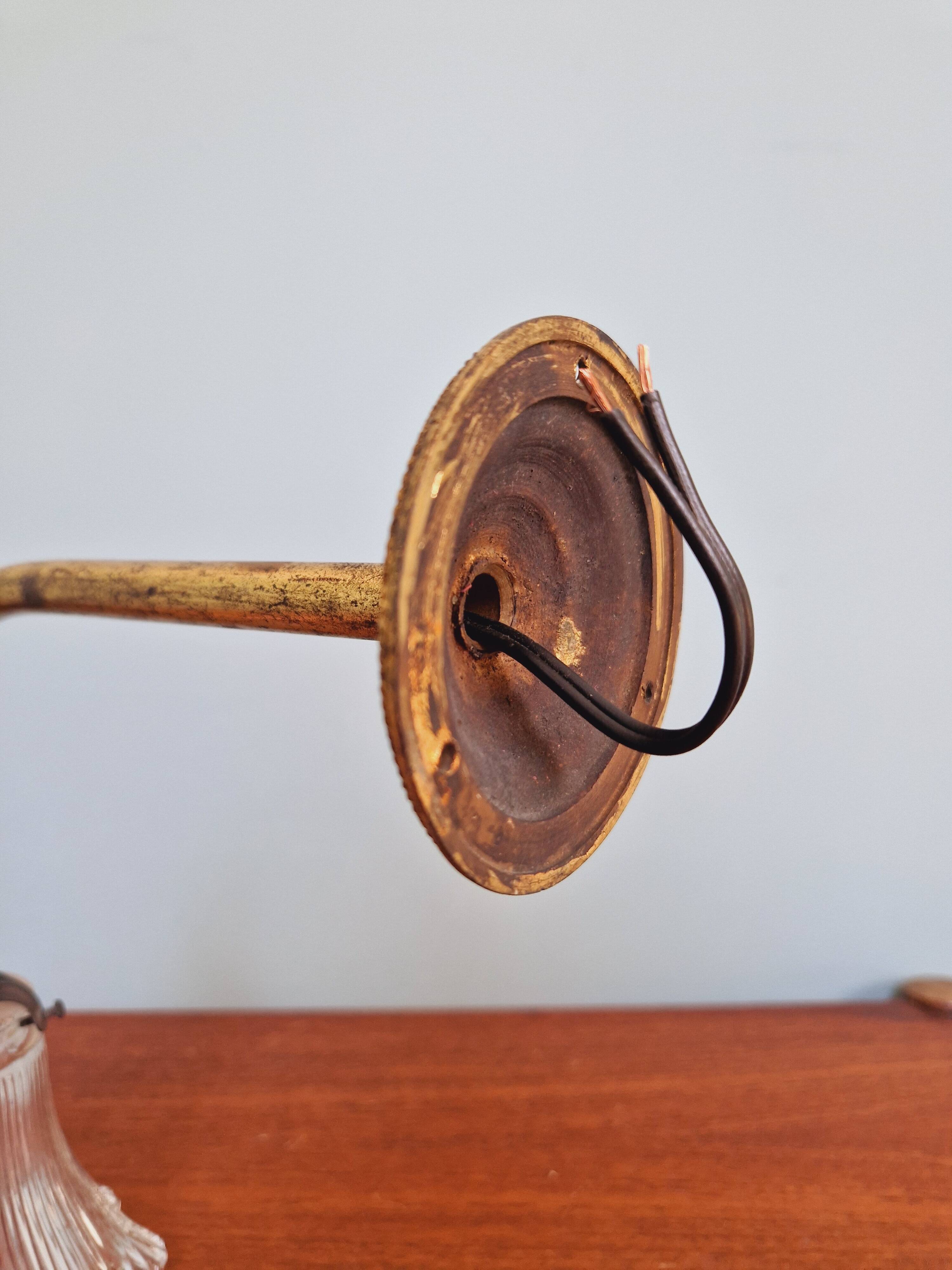Bronze wall light with grooved clear glass, early 20th century