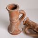 Set of two terracotta candle holders.