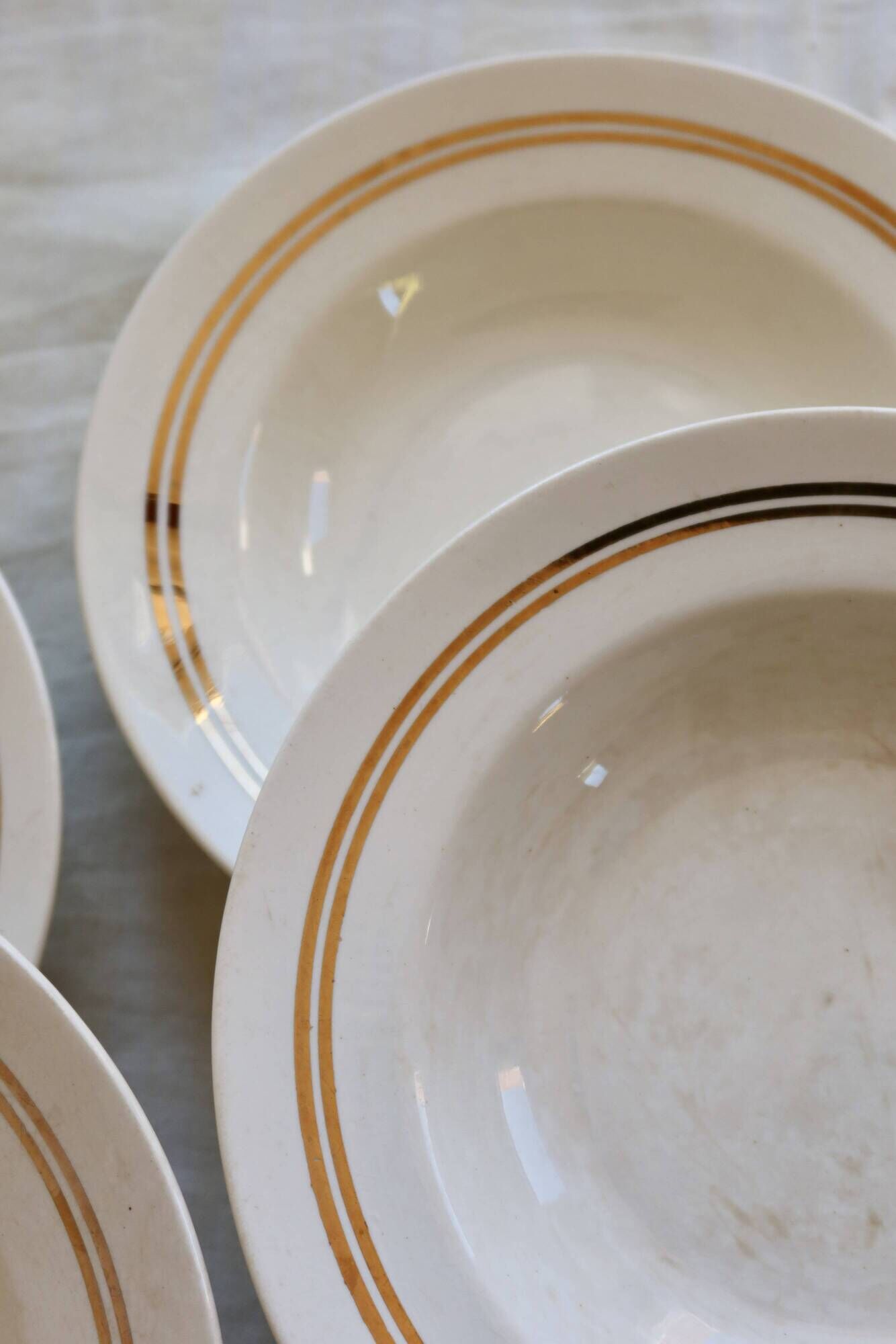 6 vintage ivory earthenware deep plates with double gold trim