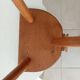 Low brutalist tripod chair in solid oak from the 1960s.