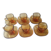 Service of 6 cups and saucers in amber glass.