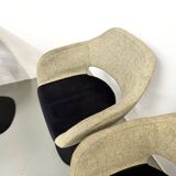 Series of six swivel chairs with an organic shell, patterned fabric and base.