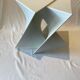 Pair of unmarked triangular white design stools