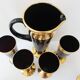 Vintage 1950s black and gold glass lemonade service.