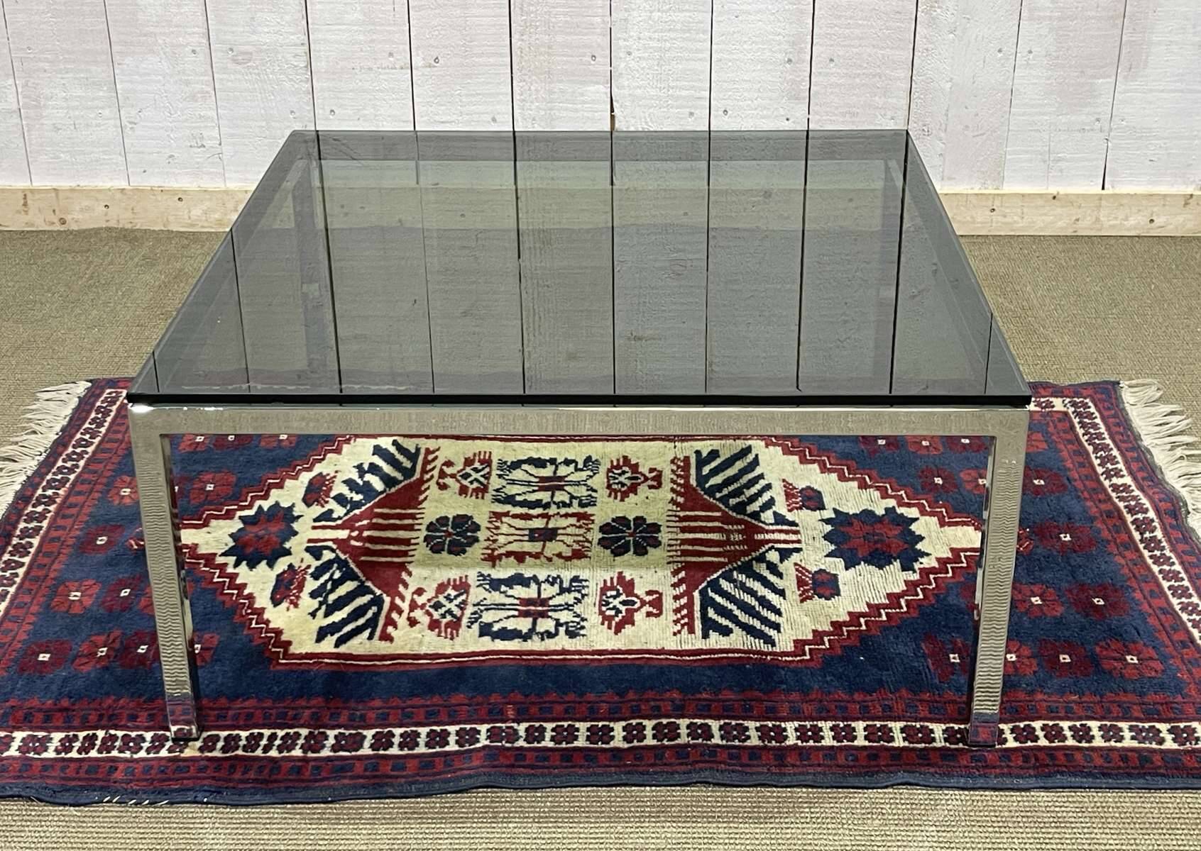 Chrome coffee table with a glass top from the 1980s.