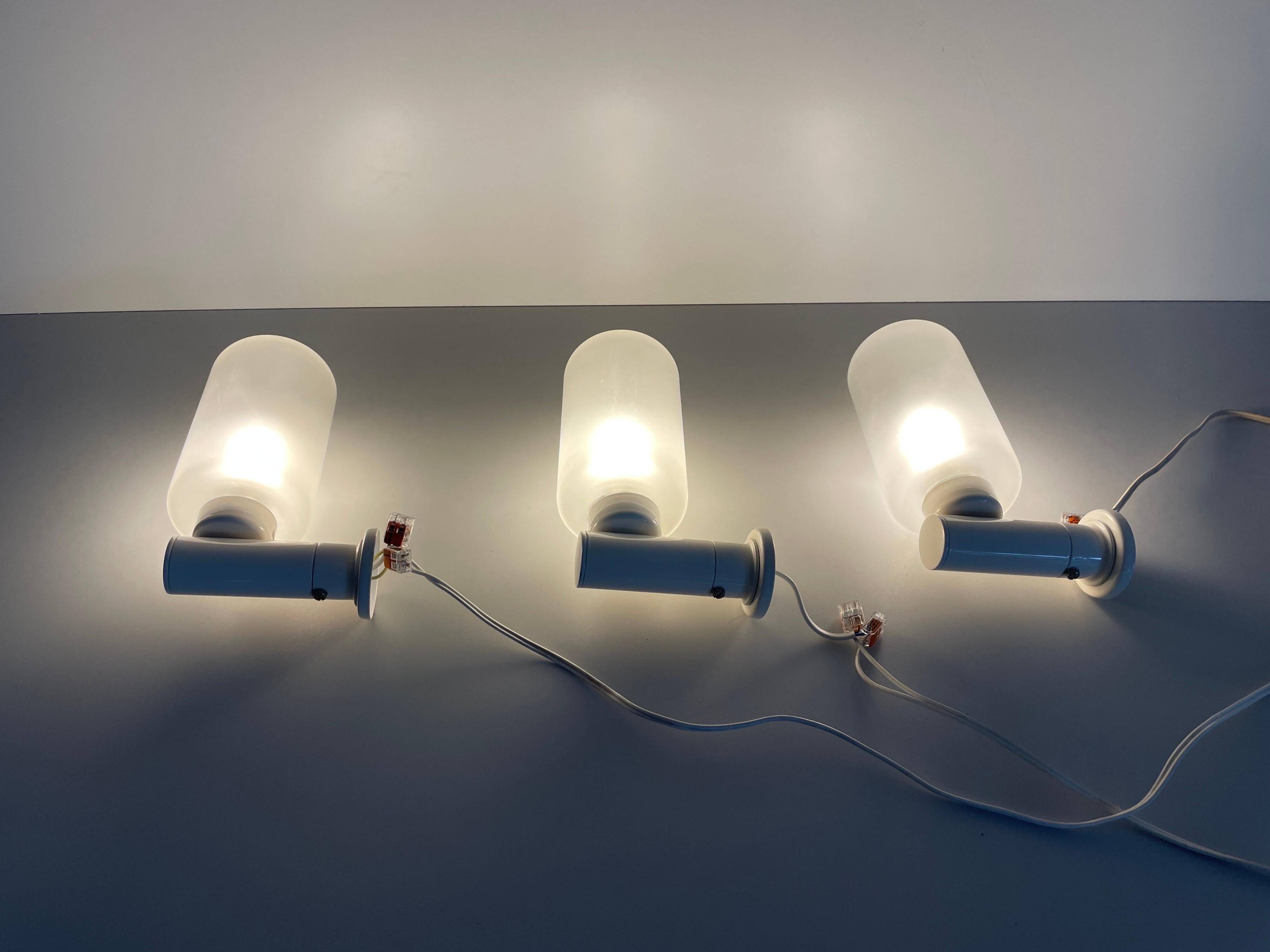 Set of 3 semi-transparent glass and white metal wall lights, 1960, Germany