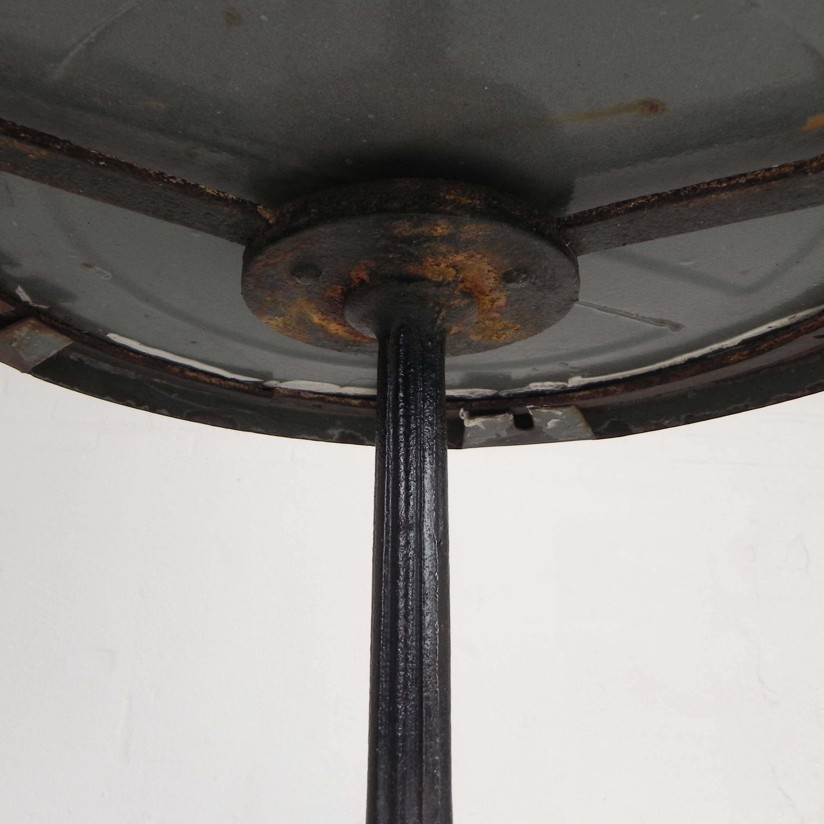 Bistro table with a cast iron base and a traffic sign as a tabletop, Paris 1920s.