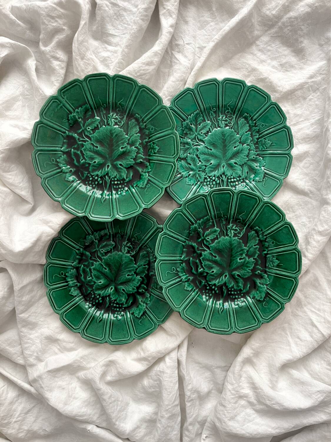 4 old plates in Sarreguemines vine leaf slip