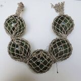 5 old glass fishing floats with rope net