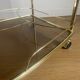 Vintage rolling service in gilded metal and smoked glass