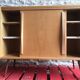 Vintage storage cabinet sliding doors feet compass