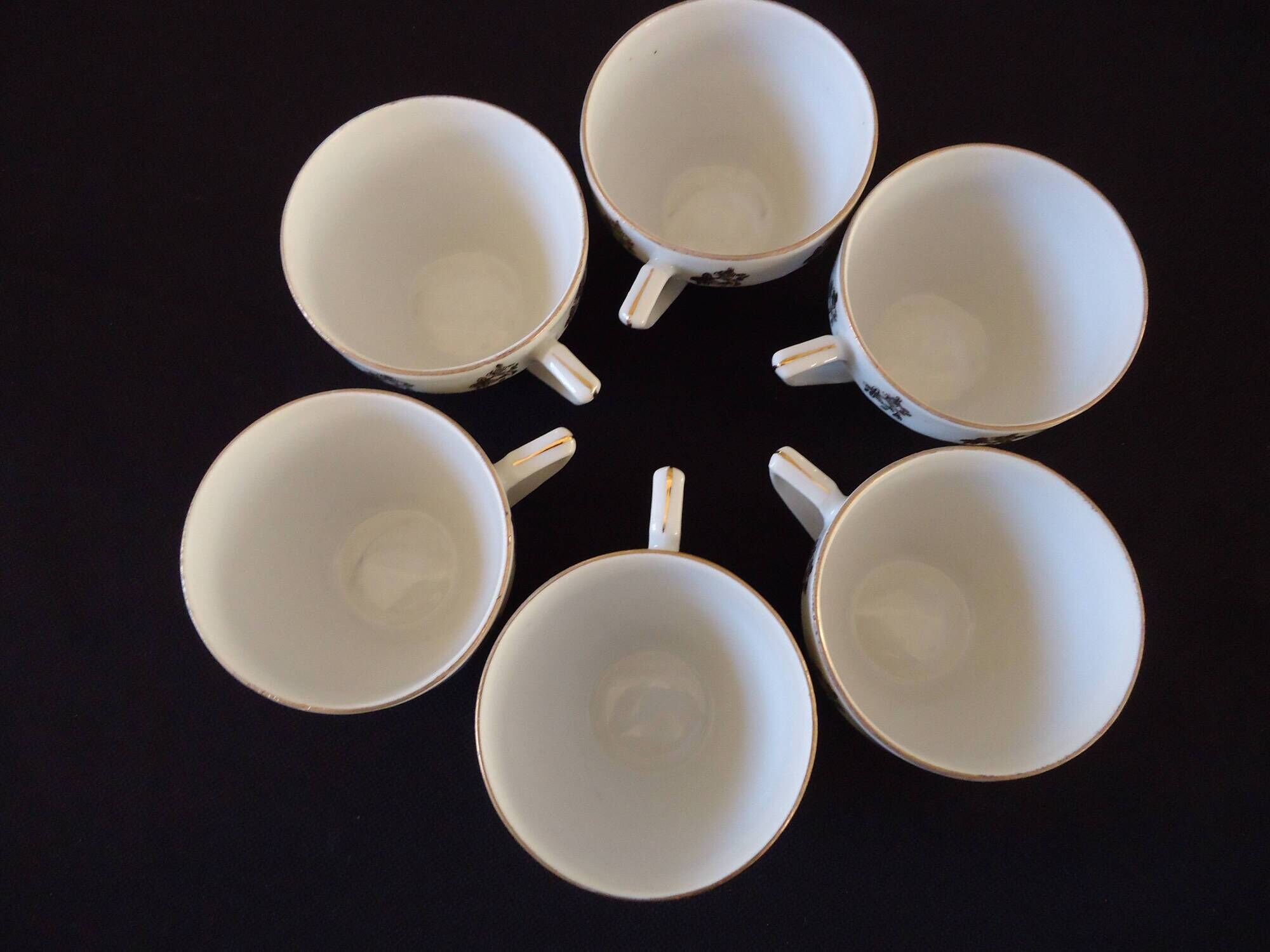 Set of six Art Deco white fine porcelain coffee cups and saucers