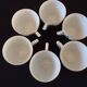 Set of six Art Deco white fine porcelain coffee cups and saucers