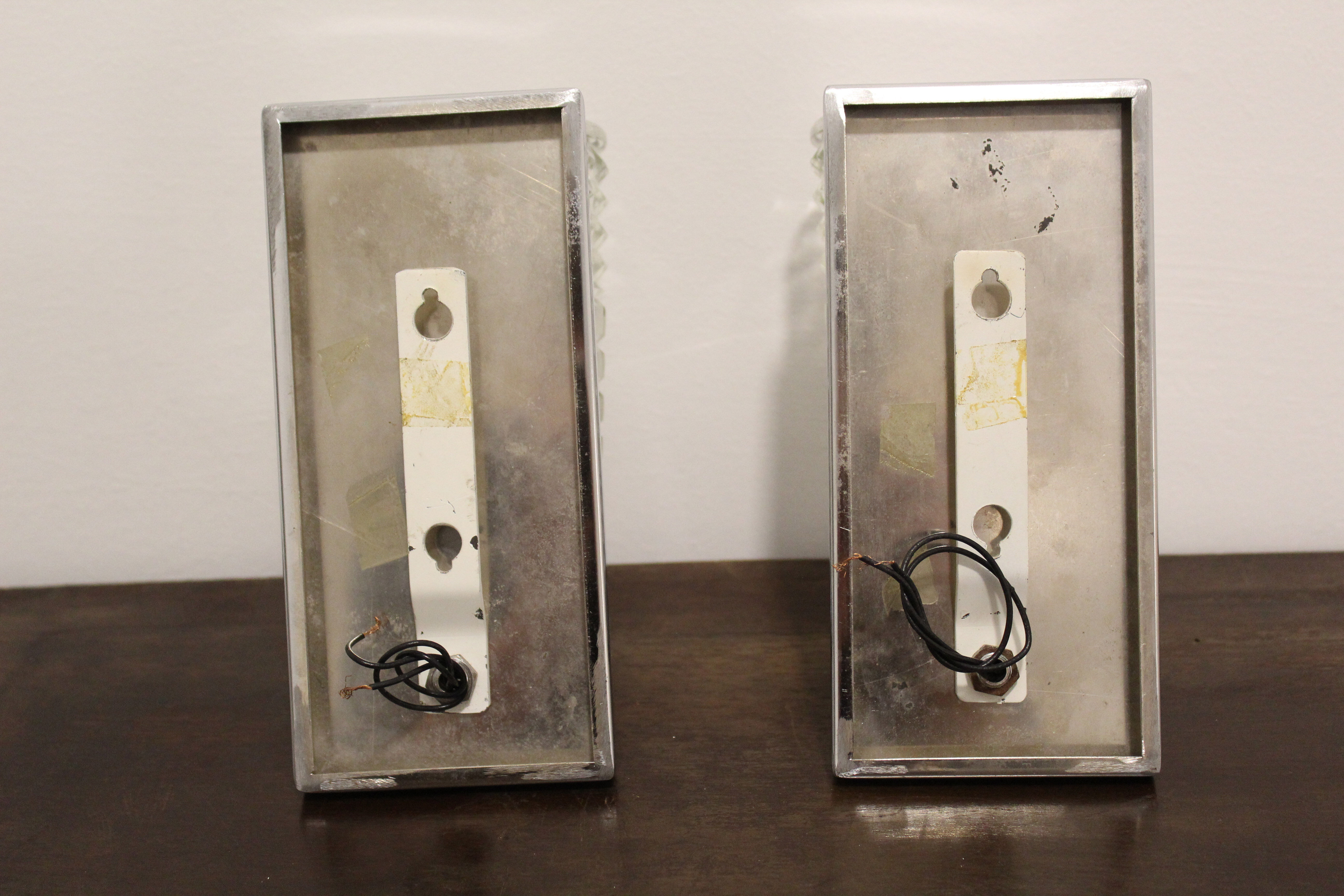 Wall lamps in worked glass and chromed metal, Italy 70's