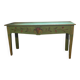 Old green wooden console with floral patterns.