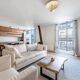Beige linen sofa and armchair with stain-resistant treatment