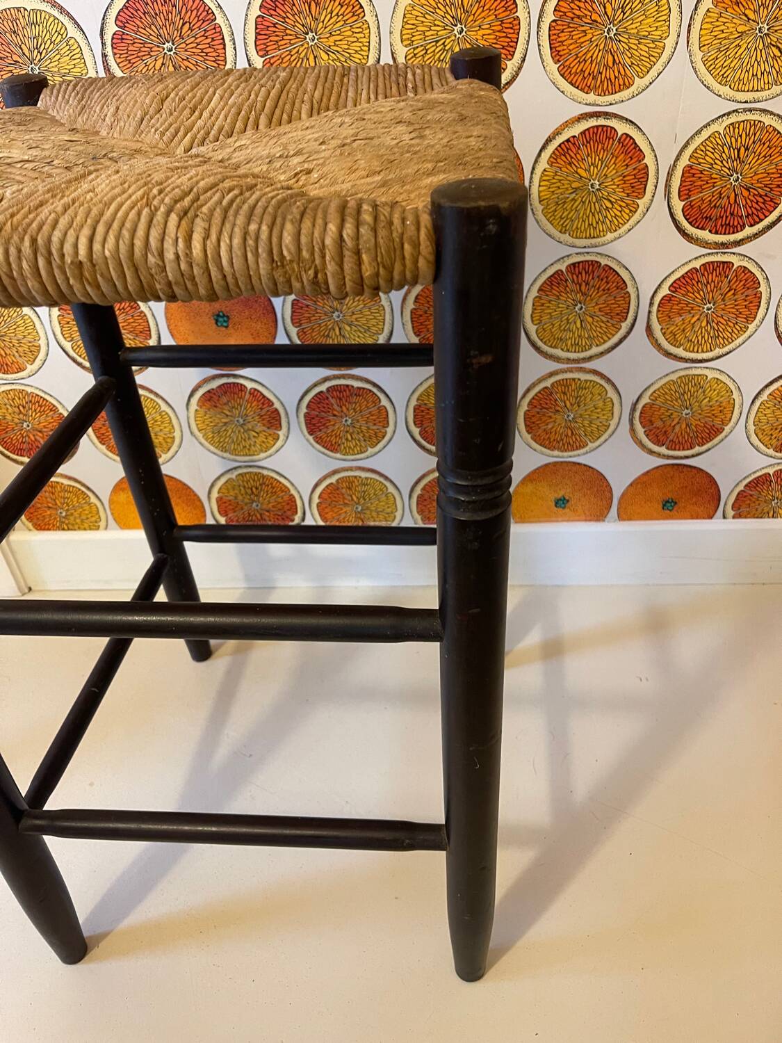 High stool made of wood and straw